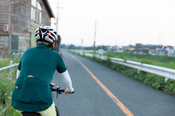 Cyclist moving through calm urban avenue