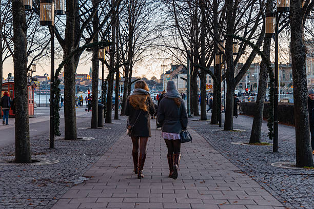 People walking along city waterfront route